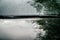 Water droplets on a metal surface. Black car hood fragment and windshield wipers with raindrops on it, closeup