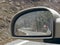 water droplets in the rear view mirror and perspective in rainy weather