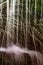 Water droplets spraying from a fountain at stony wall