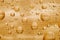 Water drops background on golden surface. Water droplets on glass.