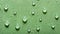 Water drops on green surface