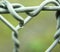 Water drops on iron border line. Barb wire with water drops