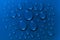 Water drops pattern on blue background