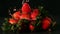 Water drops on strawberries on black surface