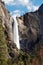 Water fall in with rocks and mountains in Yosemite