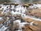 Water Falling Over Rust Colored Rocks