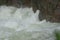 Water falling between rocks from waterfalls