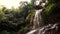 The water falls from the cascade Na Muang in Thai forest