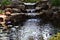 Water falls at the end of the fish pond