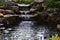 Water falls at the end of the fish pond