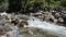 Water Falls Quickly Over Rocks in a River