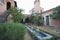 Water Feature And Metal Steps In Courtyard Garden