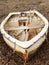 Water-filled dinghy at low tide