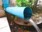 Water Flow from a Blue Pipe