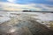 Water flowing along farmland during the spring melt