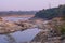 Water flowing downhill cutting the rocks and forming a river