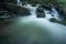 Water flowing over over rocks in river