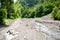 Water flowing over river rocks near mountains in Nathia Gali, Abbottabad, Pakistan