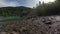 Water flowing over rocks into the Kootenai River in montana in slow motion