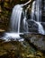 Water flows gently over the rocks and moss at Greenville\\\'s Wayside Park Middle Falls