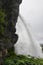 Water from the Fosselva river drops down the 50 m high powerful Steindalsfossen