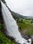 Water from the Fosselva river drops down the 50 m high powerful Steindalsfossen