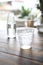 Water in glass in wood background