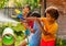 Water gun fight game with many kids in action