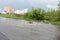 Water gushes from the storm drain. A stream of dirty water floods the roadway. Muddy liquid covered the entire road. Emergency