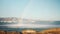 Water jet fountain with beautiful natural rainbow on Velha beach in Portugal.