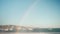 Water jet fountain with beautiful natural rainbow on Velha beach in Portugal.