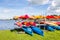 Water landscape with colorful rental canoes