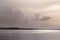 Water landscape. A large reservoir in the rays of the setting sun.