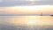 Water landscape with lighthouse and sky during daybreak