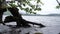 Water Laps Along Shore of Lake on Rainy Spring Day