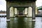 Water-level shot of the underside of a bridge.