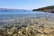 A water level view of the beautiful clear waters of Lumbarda Beach on Korcula Island, Croatia.