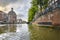 Water level view from the Singel canal in Amsterdam, Netherlands with the Round Lutheran church or Ronde Lutherse Kerk in view