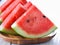 Water melon in wood plate on table