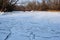 The water mirror is covered with ice of the Dnieper River near the Khortitsa Island in the frosty winter. city of Zaporozhye. Ukra