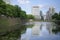 Water in moat reflecting buildings in Tokyo