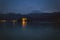 Water and mountains at night.