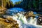 Water of the Murtle River tumbles over the edge of Whirlpool falls in the Cariboo Mountains of Wells Gray Provincial Park