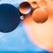 Water and oil, beautiful color abstract background based on blue and orange circles and ovals, macro abstraction