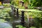 Water Palace of Tirta Gangga, Karangasem, Indonesia. Popular beautiful water palace with fountains and traditional hindu demons