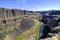 Water from Palouse Falls flows to a canyon