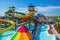 water park with colorful and whimsical water slides, including a massive spiral slide and towering wave slide