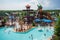 water park with themed slides and water attractions, including a pirate ship slide, giant wave slide, and waterfall