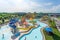 water park with variety of slides and attractions, including classic tube slide, water rapids ride, and wave pool