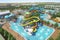 water park with variety of slides and attractions, including classic tube slide, water rapids ride, and wave pool